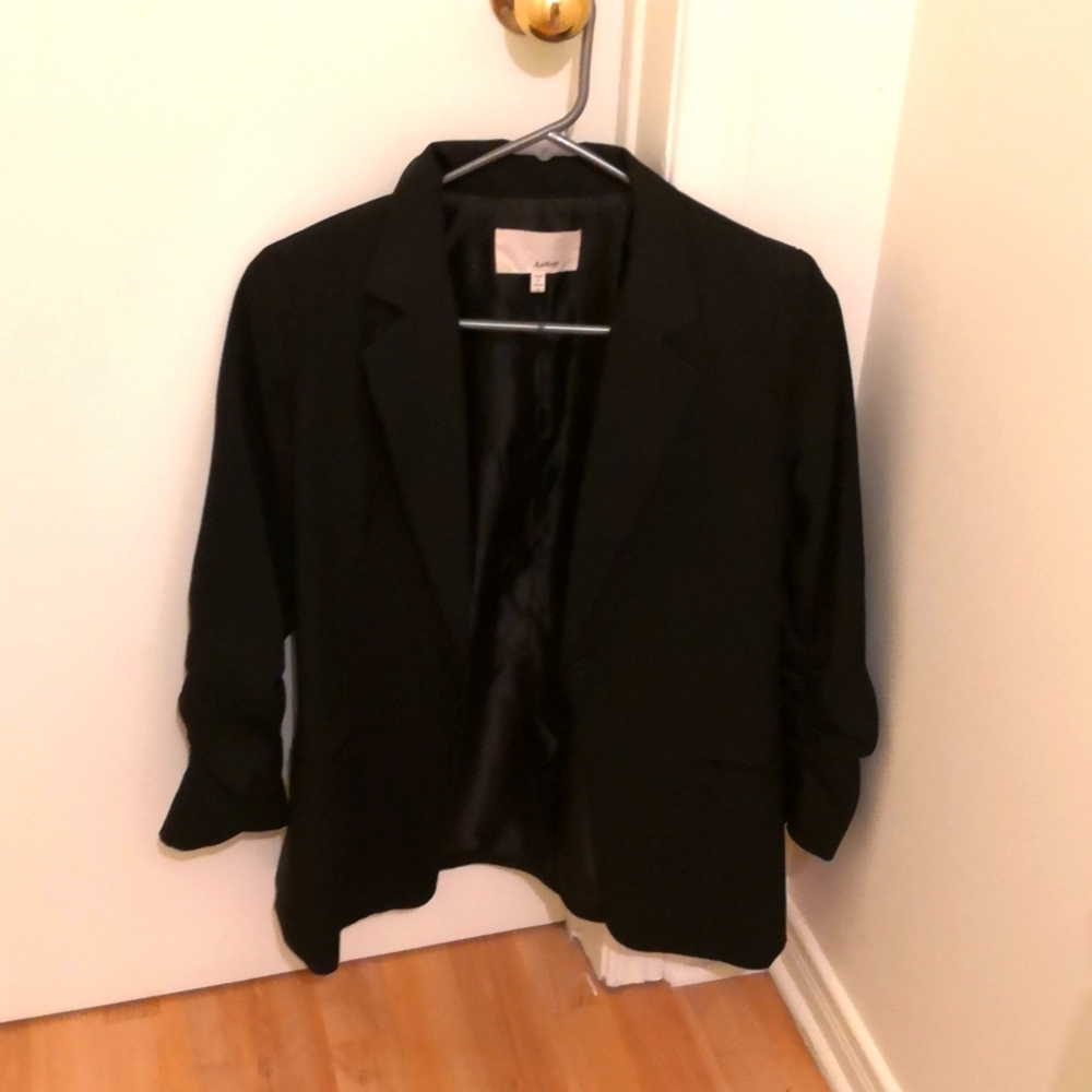 Simon's black blazer
